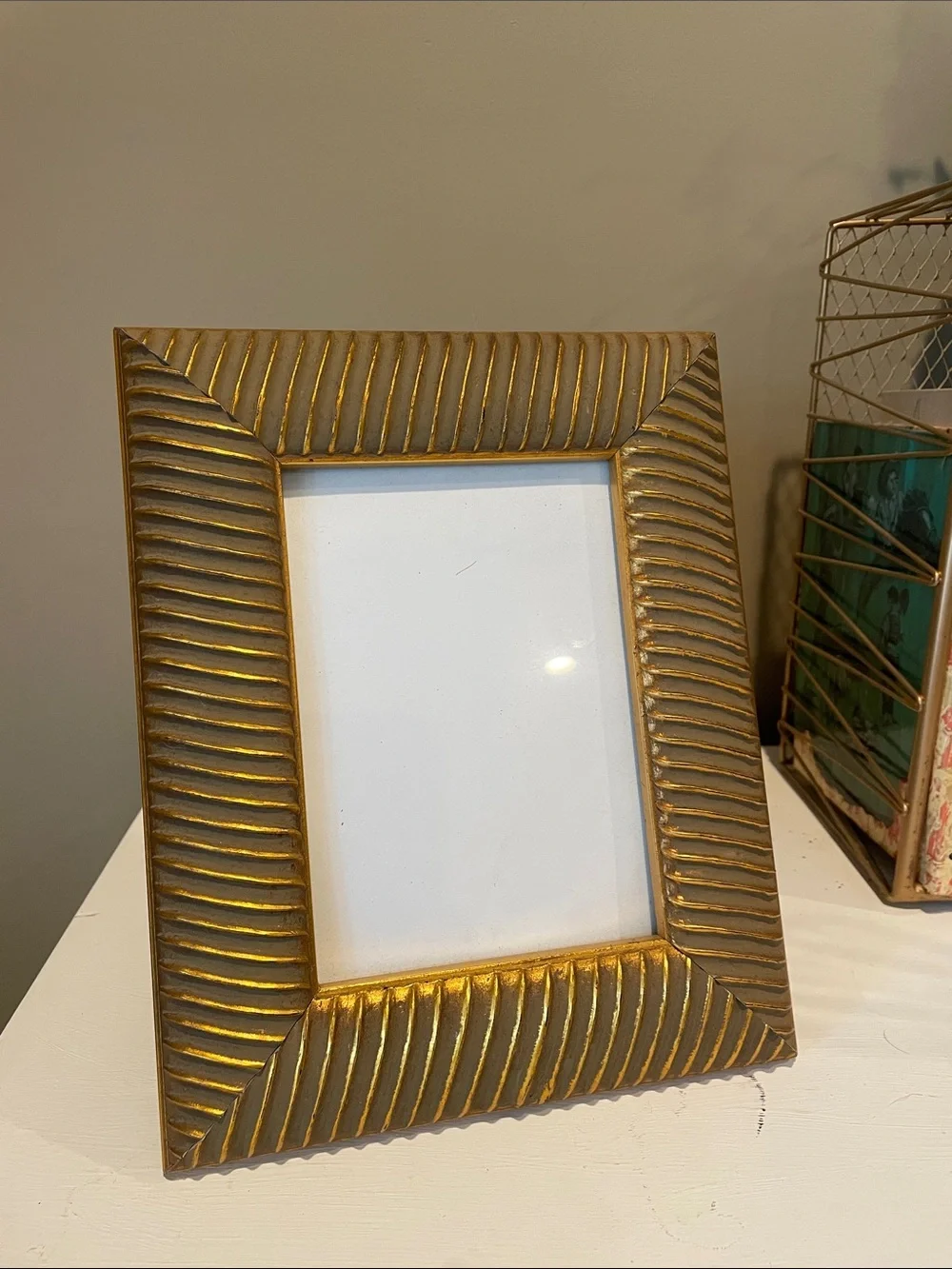 Gold detailed photo frame holds 5x7